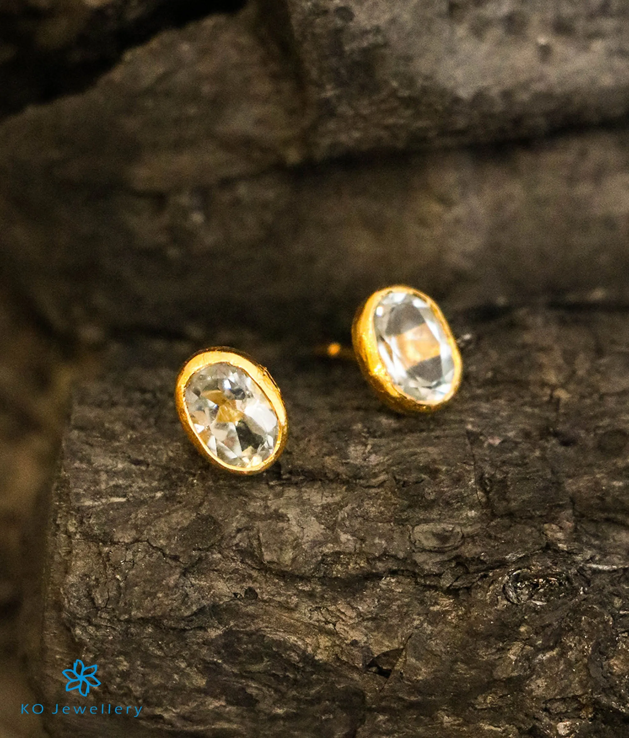 Oval Blue Topaz Earstuds in 22 KT Gold